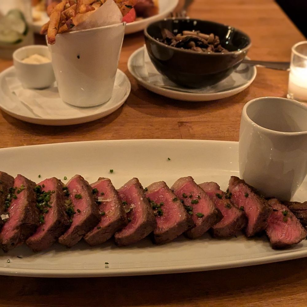 Boeufhaus - 14oz NY Strip, fries and mushrooms - Brasseries Near Me - Chicago, Illinois Boeufhaus - 14oz NY Strip, fries and mushrooms - Brasseries Near Me - Chicago, Illinois