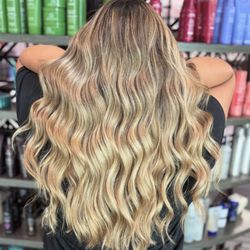 Spoleti Salon - Super bright, sun-kissed golden blonde highlights for that radiant glow. Visit Spoleti Salon in Pflugerville for your perfect blonde.