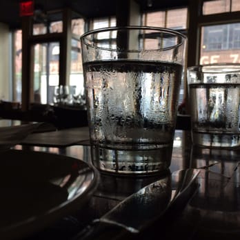 Left Bank - Tap water sweating on our bare table - New American Near Me - New York, New York Left Bank - Tap water sweating on our bare table - New American Near Me - New York, New York