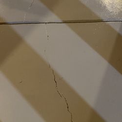 Concrete Floor Supply - cracks in painted final surface that could have been addressed
