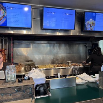 Broosters Char-Broiled - a woman sitting at a counter - American Near Me - Darien, Illinois Broosters Char-Broiled - a woman sitting at a counter - American Near Me - Darien, Illinois