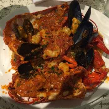 Carpaccio - Lobster with seafood over angel hair pasta. - Italian Near Me - Bal Harbour, Florida