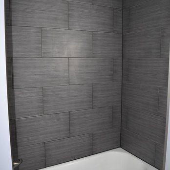 Port Building - a bathtub and shower in a bathroom - General Contractors Near Me - Charlestown, Indiana Port Building - a bathtub and shower in a bathroom - General Contractors Near Me - Charlestown, Indiana