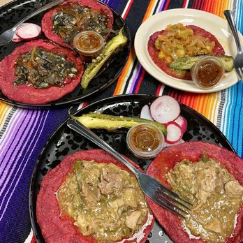 Mexitli Restaurant - Top left: corn mushroom tacos Top right: pumpkin flower tacos Bottom: green pork Chile with cactus tacos - Mexican Near Me - Omaha, Nebraska Mexitli Restaurant - Top left: corn mushroom tacos Top right: pumpkin flower tacos Bottom: green pork Chile with cactus tacos - Mexican Near Me - Omaha, Nebraska