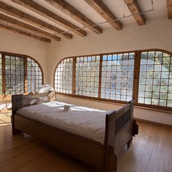 Taos Art Museum at Fechin House - Sunroom with daughter's bed carved by Fechin