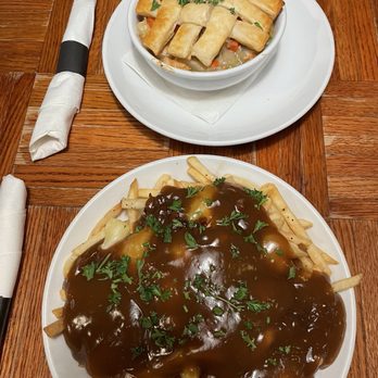 Soho Kitchen and Bar - Chicken pot pie on top and Maple bacon poutine. - American Near Me - Sioux City, Iowa Soho Kitchen and Bar - Chicken pot pie on top and Maple bacon poutine. - American Near Me - Sioux City, Iowa