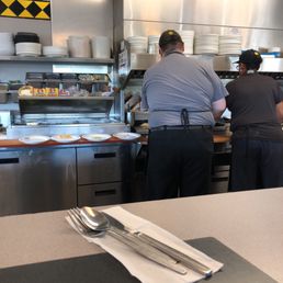 two people working in the kitchen two people working in the kitchen