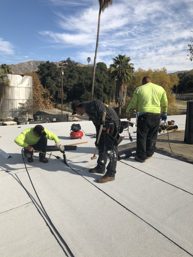 Slide of Reno's Roofing