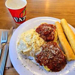 Fazoli's - Classic Sampler: includes fettuccine alfredo, lasagna with meat sauce, and spaghetti marinara, meatball, plus two garlic breadsticks.
