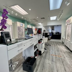 Geneva Eye Care - Clean, modern interior. Lots of glasses for adults and kids