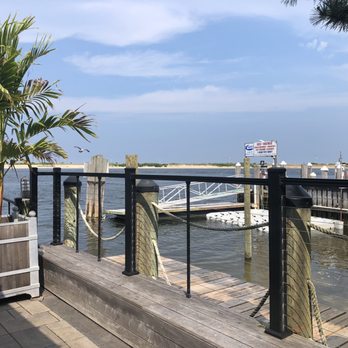 Proving Ground Waterfront Dining - Views of Sandy Hook from the patio - Tiki Bars Near Me - Highlands, New Jersey Proving Ground Waterfront Dining - Views of Sandy Hook from the patio - Tiki Bars Near Me - Highlands, New Jersey