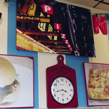 Sizzle Pi - a wall of food and a clock - Pizza Near Me - Kingston, Pennsylvania Sizzle Pi - a wall of food and a clock - Pizza Near Me - Kingston, Pennsylvania