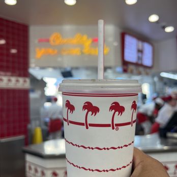 In-N-Out Burger - ows a hand holding a cup with a straw - Burgers Near Me - Fairfield, California
