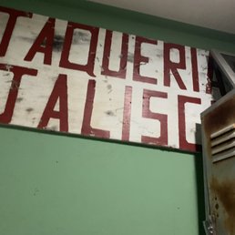 This is the old Taqueria Jalisco sign in the bathroom. It has now moved across the street. Great area to bar hop!