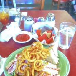 the triple decker club with crispy seasoned curly fries. the triple decker club with crispy seasoned curly fries.