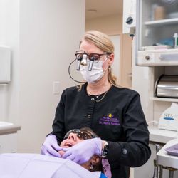 Tri-Cities Center For Cosmetic Dentistry - Dr. Kathy Sanders working with a paitent in in our comfortable and state-of the art dental suites.