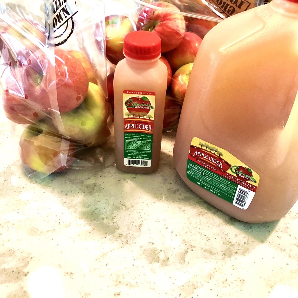 a bottle of apple juice and a jug of apple juice a bottle of apple juice and a jug of apple juice