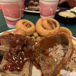 Ribs , brisket, pulled pork with onion rings and fried okra Ribs , brisket, pulled pork with onion rings and fried okra