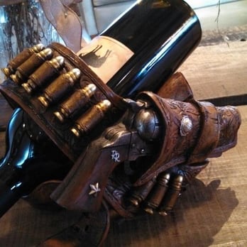 Refugio Ranch Vineyards - Really cool display of the wine bottle in a gun belt - Wine Bars Near Me - Los Olivos, California Refugio Ranch Vineyards - Really cool display of the wine bottle in a gun belt - Wine Bars Near Me - Los Olivos, California