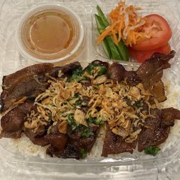 Grilled pork with rice.
