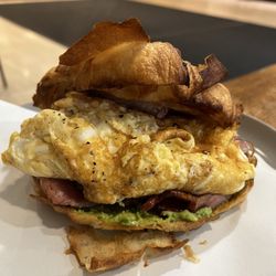 Bacon egg and avocado on croissant. This was one egg.