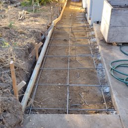 This shows the framing and the rebar for the drainage ditch. I was delighted with their work. Top quality workmanship.
