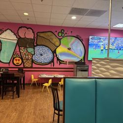 Scoop Du Jour - Seating area, mural