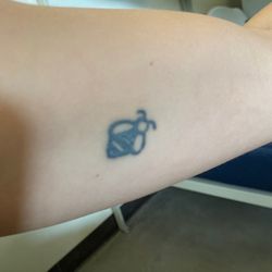 Sideshow Tattoos & Piercings - After 5 tattoo removal laser sessions