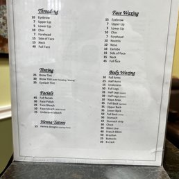Price list - Price list from The Threading Salon in Chicago, IL, showing costs for threading, face waxing, body waxing, facials, and henna tattoos.
