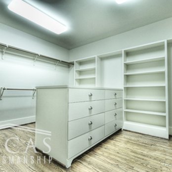 Lucas Craftsmanship - a walk - in closet with white cabinets - General Contractors Near Me - Houston, Texas Lucas Craftsmanship - a walk - in closet with white cabinets - General Contractors Near Me - Houston, Texas