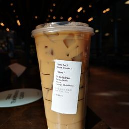 a cup of iced coffee on a table