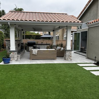 Taveras Custom Landscape - Side of new pet turf, stepping tiles and stone work - Artificial Turf Near Me Taveras Custom Landscape - Side of new pet turf, stepping tiles and stone work - Artificial Turf Near Me