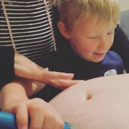 My midwife helping my son to hear his baby brothers heartbeat! My midwife helping my son to hear his baby brothers heartbeat!