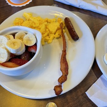 Denny's - The bacon and sausage that came with ChocoBanana pancakes, and side fruit for $2.49 more in lieu of hash browns - American Near Me - Yorba Linda, California Denny's - The bacon and sausage that came with ChocoBanana pancakes, and side fruit for $2.49 more in lieu of hash browns - American Near Me - Yorba Linda, California