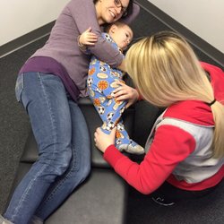 HomeTown Health & Wellness - Pediatric adjustments help with sleep, digestion, brain function, and contributes to overall health.  Dr. Ryan adjusts an 18 month old.