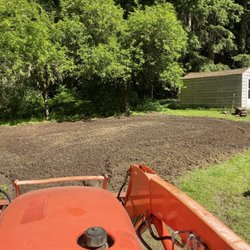 Triple Falls Land Clearing & Earthworks - Cleared out this mess of a side yard and turned it into a perfectly rototilled new garden space for these customers.
