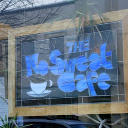 the reflection of a cup of coffee in the window the reflection of a cup of coffee in the window