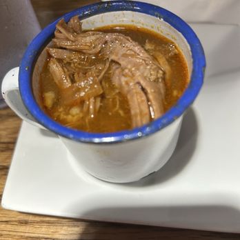 JJ’s Cafe - Close-up of the birria that is one of several meat choices with the chilaquiles - Bars Near Me - Garland, Texas