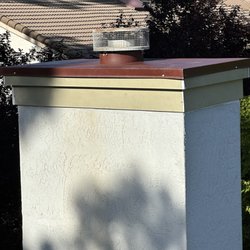 Blue Ribbon Construction - Chimney cap and trim repair