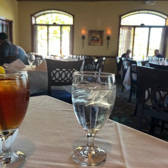 Mosaico - a glass of water and a drink on a table - Italian Near Me - Mountainside, New Jersey