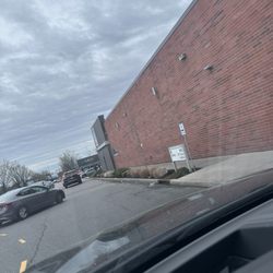 ALDI - The VERY small 8X10 sign on the side of the store indicating that curbside is in the back.