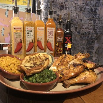 Nando's - Chicken with garlic bread, garlic bread, macho peas, and mashed potato - Chicken Shop Near Me - Soho, XGL