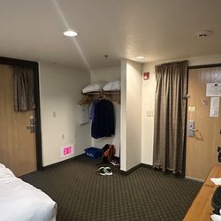 AmericInn by Wyndham Cody - Entry and closet space in triple queen room