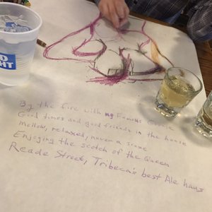 Photo of Reade Street Pub & Kitchen - New York, NY, United States. Whisky and drawing at the table by the fire