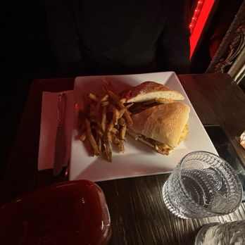 Saints and Scholars - a sandwich and fries on a plate - Bars Near Me - Yonkers, New York