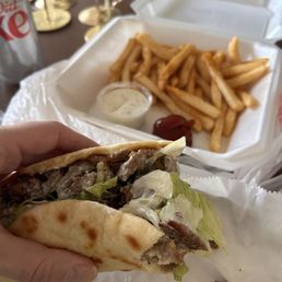 Gyro meal comes with fries and a can of soda Gyro meal comes with fries and a can of soda