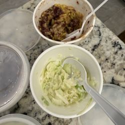 Sides of the family size meal - received two small portions of coleslaw and rice and beans.