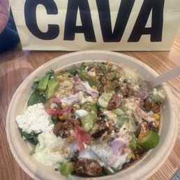 Harissa Avacado Chicken bowl with brown rice and a trio of fresh greens