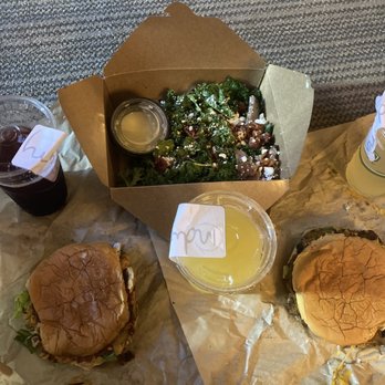 Industry - L-r Smoked salmon burger, farm beet salad, veggie burger. Drinks are White Box, mimosas, and The Closer. - New American Near Me - San Marcos, Texas Industry - L-r Smoked salmon burger, farm beet salad, veggie burger. Drinks are White Box, mimosas, and The Closer. - New American Near Me - San Marcos, Texas