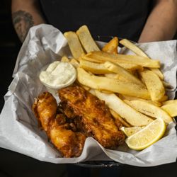 Lucky Baldwins Pub - Our famous British comfort classic, fish and chips served up by one of our friendly staff members